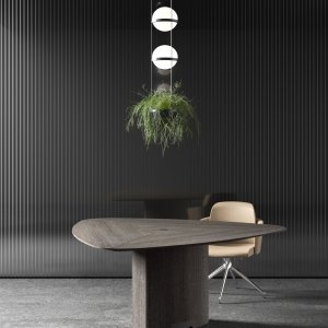 Inserto de pele com costura à vista na mesa Trilo